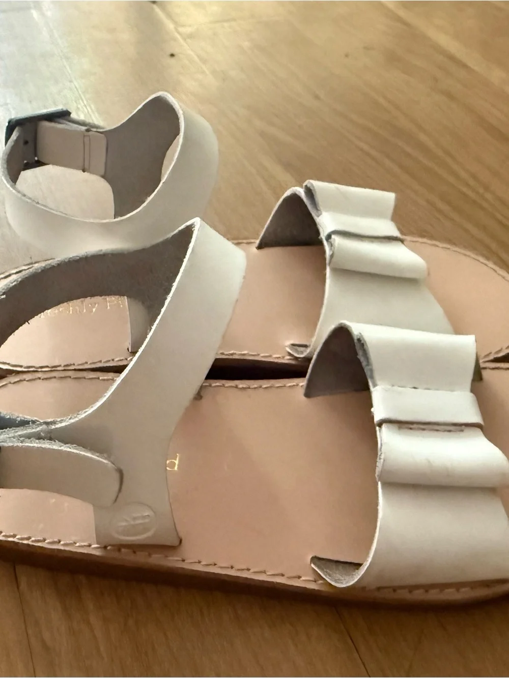 Freshly Picked Gold Embossed Logo on Cream Leather